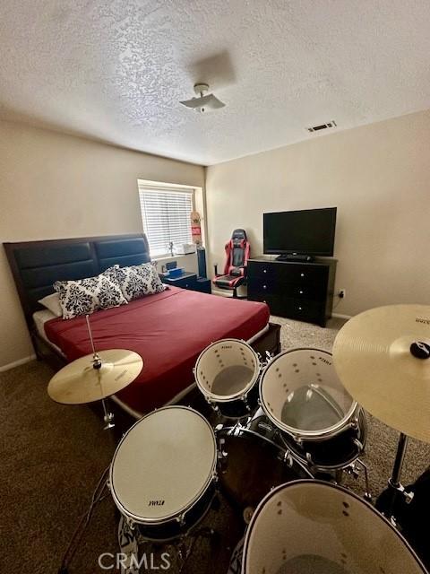 13133 4th Ave, Victorville, CA 92395 - game room with a textured ceiling and carpet flooring