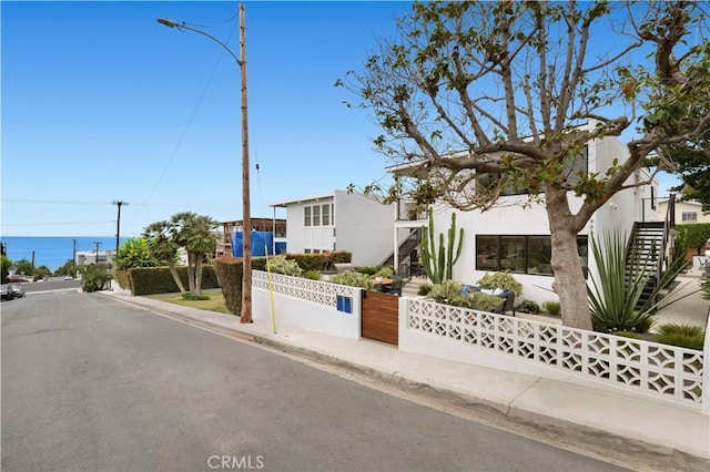 246 Fairview St, Laguna Beach, CA 92651 - view of front of home with stucco siding and stairs