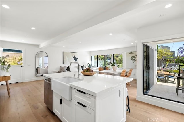 246 Fairview St, Laguna Beach, CA 92651 - kitchen featuring light wood finished floors, healthy amount of natural light, recessed lighting, open floor plan, and light countertops