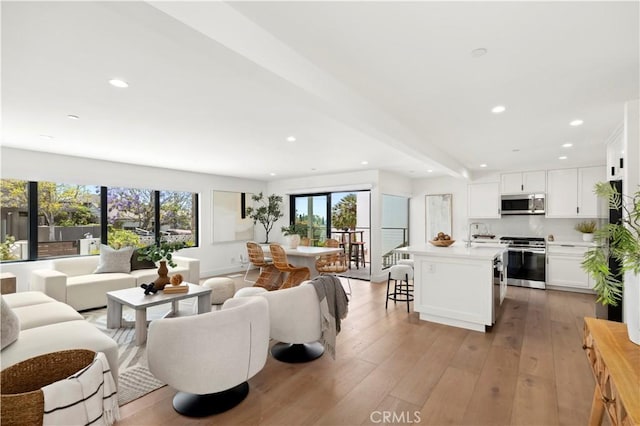 246 Fairview St, Laguna Beach, CA 92651 - living area with plenty of natural light, recessed lighting, and light wood-type flooring