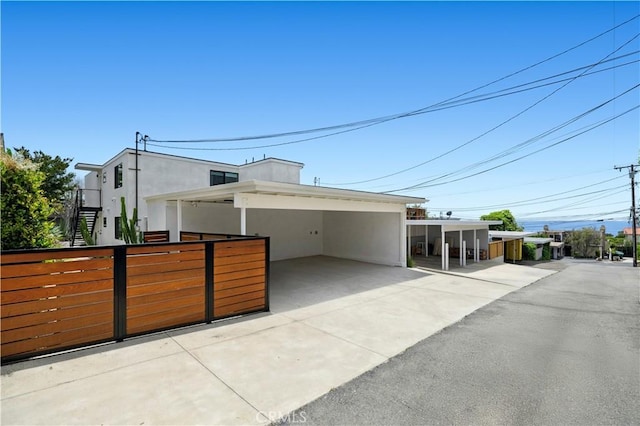 246 Fairview St, Laguna Beach, CA 92651 - view of front of home with stucco siding and a carport