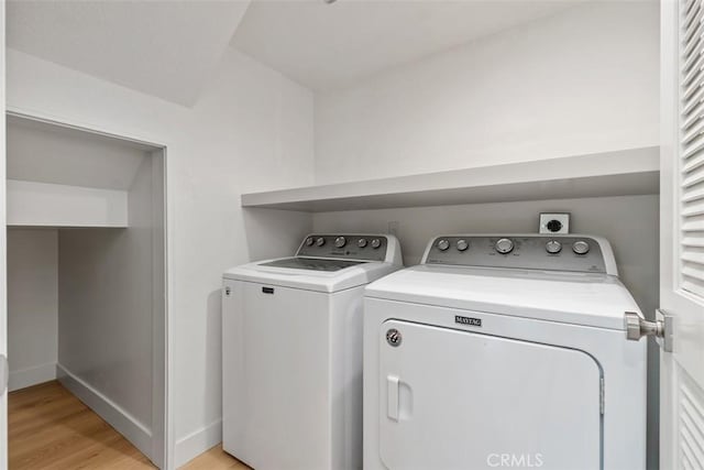 24616 Polaris Dr Unit 272, Dana Point, CA 92629 - washroom with washer and dryer and light wood finished floors