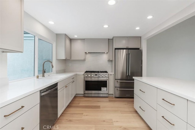 24616 Polaris Dr Unit 272, Dana Point, CA 92629 - kitchen featuring high end appliances, light countertops, recessed lighting, light wood finished floors, and gray cabinets