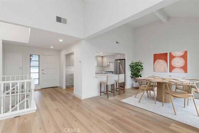 24616 Polaris Dr Unit 272, Dana Point, CA 92629 - dining area with high vaulted ceiling, light wood finished floors, beamed ceiling, and recessed lighting