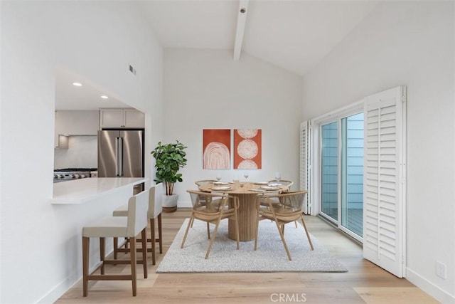 24616 Polaris Dr Unit 272, Dana Point, CA 92629 - dining space featuring high vaulted ceiling, beamed ceiling, light wood-style floors, and recessed lighting