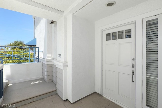 2600 Newport Blvd Unit 219, Newport Beach, CA 92663 - view of exterior entry featuring a balcony