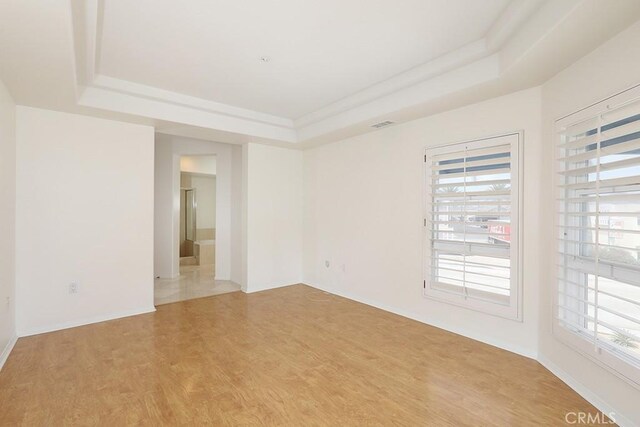 2600 Newport Blvd Unit 219, Newport Beach, CA 92663 - empty room with a tray ceiling and light wood-style floors
