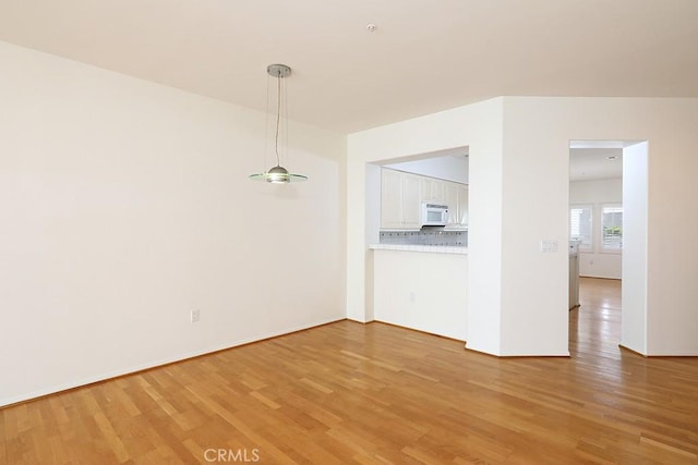 2600 Newport Blvd Unit 219, Newport Beach, CA 92663 - unfurnished dining area with light wood-type flooring