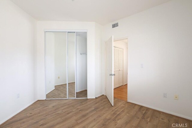2600 Newport Blvd Unit 219, Newport Beach, CA 92663 - unfurnished bedroom featuring wood finished floors and a closet