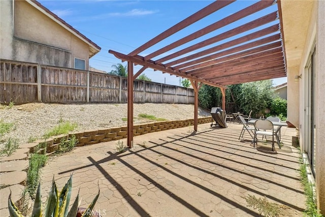 16737 Windcrest Dr, Fontana, CA 92337 - fenced backyard with a patio, a pergola, and outdoor dining space