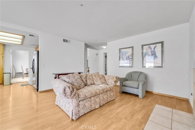 16737 Windcrest Dr, Fontana, CA 92337 - living area with light wood-style flooring and baseboards