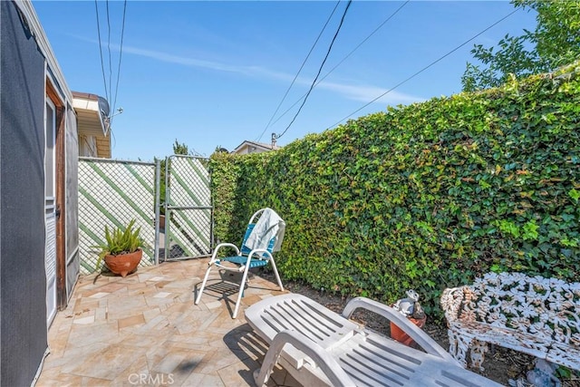 28839 Carmel Rd, Menifee, CA 92586 - fenced backyard featuring a gate and a patio