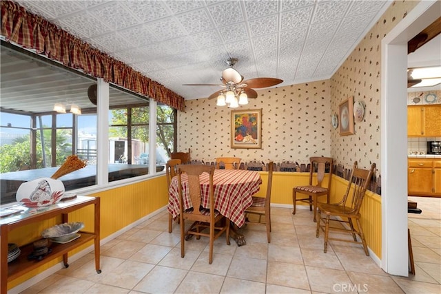 28839 Carmel Rd, Menifee, CA 92586 - dining area with a ceiling fan, wallpapered walls, and light tile patterned flooring