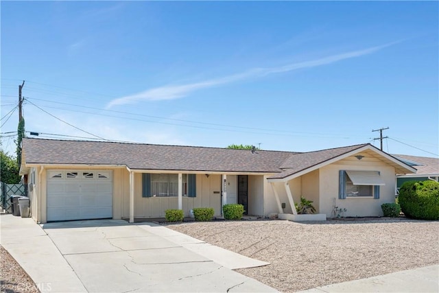 28839 Carmel Rd, Menifee, CA 92586 - ranch-style house with a garage, driveway, board and batten siding, and a shingled roof