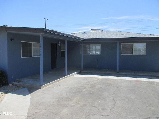 44244 Carolside Ave, Lancaster, CA 93535 - rear view of property with stucco siding and a shingled roof