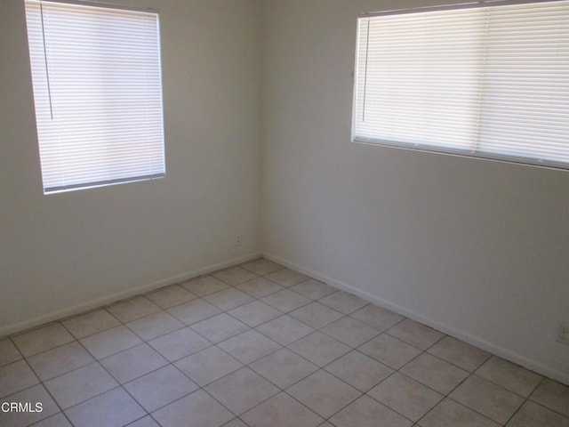 44244 Carolside Ave, Lancaster, CA 93535 - unfurnished room with healthy amount of natural light and light tile patterned floors
