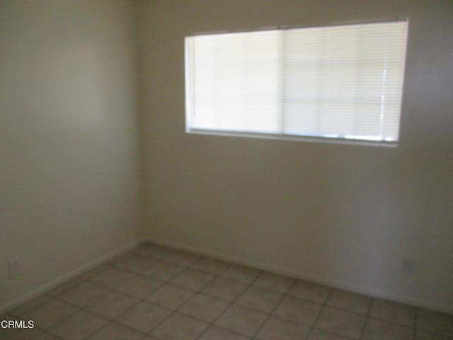 44244 Carolside Ave, Lancaster, CA 93535 - spare room with healthy amount of natural light and light tile patterned floors