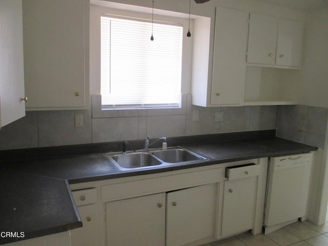 44244 Carolside Ave, Lancaster, CA 93535 - kitchen with white dishwasher, dark countertops, white cabinets, and healthy amount of natural light