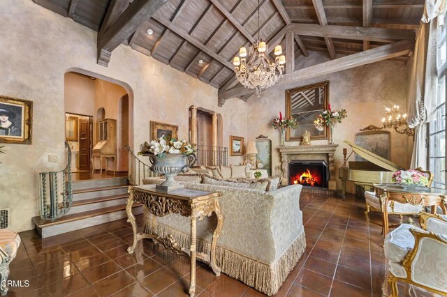 1205 Linda Vista Ave, Pasadena, CA 91103 - living area with a wooden ceiling with exposed beams, a chandelier, arched walkways, a warm lit fireplace, and high vaulted ceiling