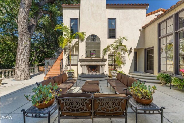 1205 Linda Vista Ave, Pasadena, CA 91103 - view of patio / terrace featuring an outdoor living space with a fireplace and stairs