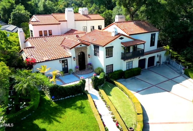 1205 Linda Vista Ave, Pasadena, CA 91103 - mediterranean / spanish home with a chimney, stucco siding, a balcony, and a tile roof