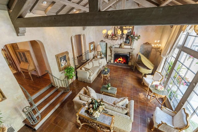 1205 Linda Vista Ave, Pasadena, CA 91103 - living room with beamed ceiling, a chandelier, a warm lit fireplace, high vaulted ceiling, and tile patterned flooring