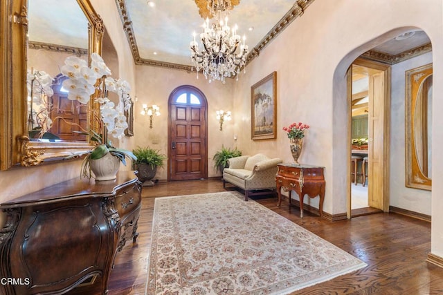 1205 Linda Vista Ave, Pasadena, CA 91103 - foyer with arched walkways, a chandelier, wood finished floors, and crown molding