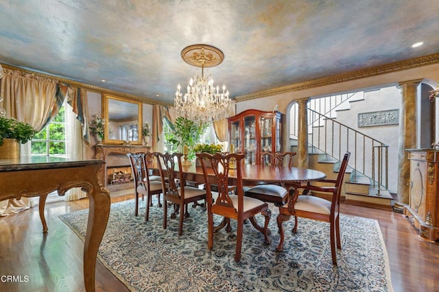 1205 Linda Vista Ave, Pasadena, CA 91103 - dining space with wood finished floors, stairs, a chandelier, and ornamental molding