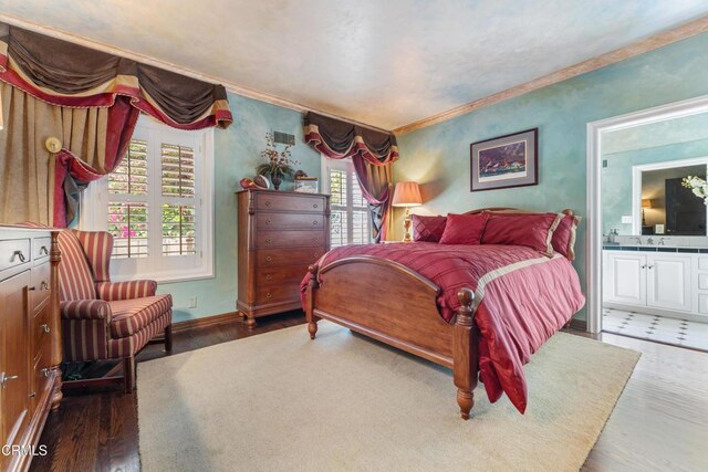 1205 Linda Vista Ave, Pasadena, CA 91103 - bedroom with multiple windows, wood finished floors, ornamental molding, and ensuite bath