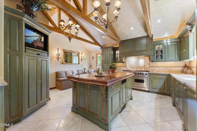 1205 Linda Vista Ave, Pasadena, CA 91103 - kitchen with green cabinetry, stainless steel stove, a chandelier, decorative backsplash, and light tile patterned floors