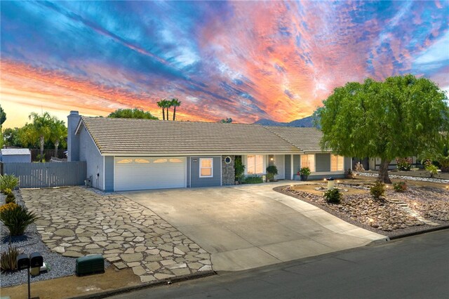 32618 Durango Ct, Wildomar, CA 92595 - single story home featuring an attached garage, driveway, a tiled roof, stucco siding, and a chimney