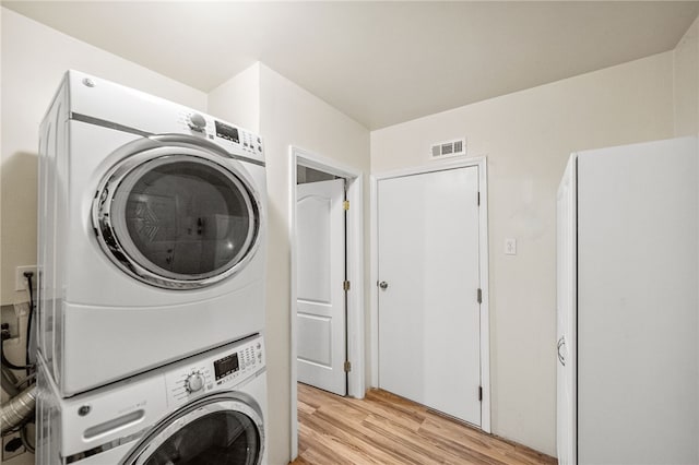 32618 Durango Ct, Wildomar, CA 92595 - laundry room featuring stacked washer / drying machine and light wood finished floors