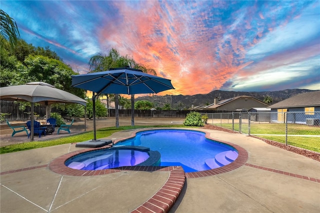 32618 Durango Ct, Wildomar, CA 92595 - view of swimming pool with a patio area, a fenced backyard, a pool with connected hot tub, and a mountain view
