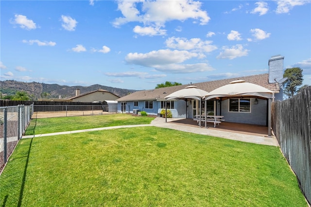 32618 Durango Ct, Wildomar, CA 92595 - back of property with a patio area, a chimney, a fenced backyard, and stucco siding