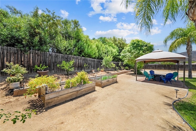 32618 Durango Ct, Wildomar, CA 92595 - fenced backyard featuring a gazebo, a vegetable garden, and a patio