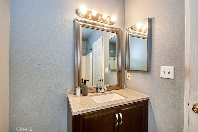 11131 Dodson St Unit 7, El Monte, CA 91733 - bathroom featuring vanity and a textured wall