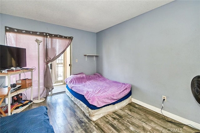 11131 Dodson St Unit 7, El Monte, CA 91733 - bedroom with wood finished floors and a textured ceiling