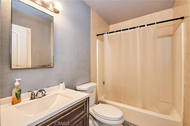 11131 Dodson St Unit 7, El Monte, CA 91733 - full bathroom with vanity, shower / bath combo with shower curtain, and a textured wall