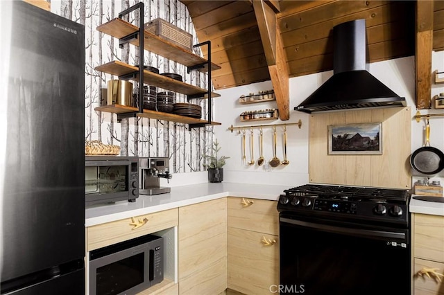 350 S Fairway Dr, Lake Arrowhead, CA 92352 - kitchen featuring black gas range, fridge, wall chimney range hood, stainless steel microwave, and light brown cabinetry