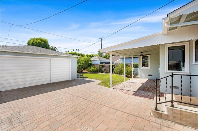 2412 Santiago St, Santa Ana, CA 92706 - view of patio / terrace with a garage and an outbuilding