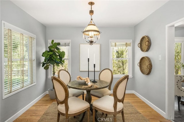 2412 Santiago St, Santa Ana, CA 92706 - dining space featuring light wood finished floors and a chandelier
