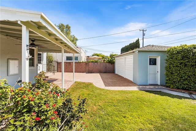 2412 Santiago St, Santa Ana, CA 92706 - view of yard featuring a patio, an outbuilding, and a garage