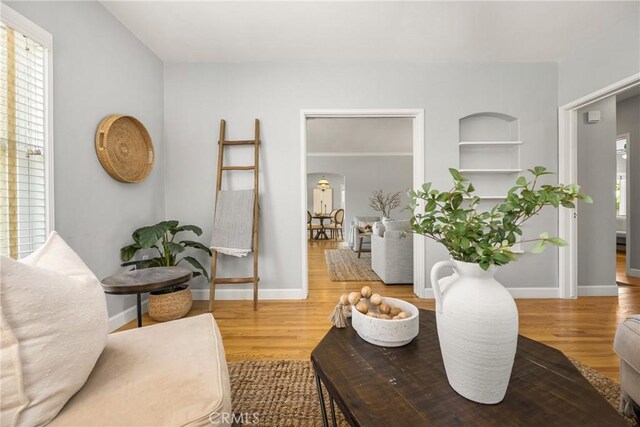 2412 Santiago St, Santa Ana, CA 92706 - living room featuring wood finished floors and built in shelves