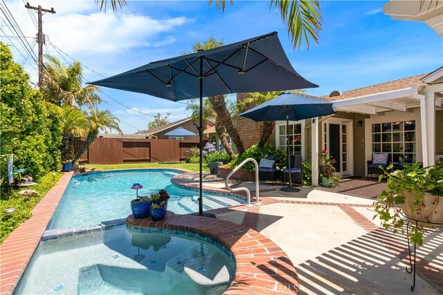 3191 Woodstock Rd, Rossmoor, CA 90720 - view of swimming pool with a patio and a pool with connected hot tub