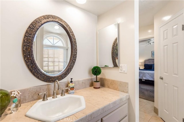 3191 Woodstock Rd, Rossmoor, CA 90720 - bathroom featuring ensuite bath, vanity, tile patterned floors, and ceiling fan