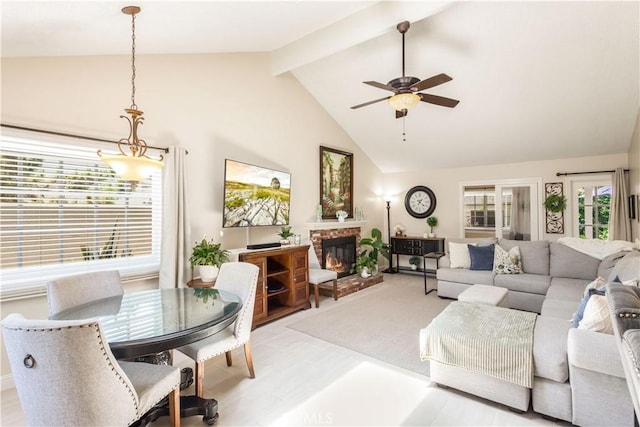 3191 Woodstock Rd, Rossmoor, CA 90720 - living room with ceiling fan, beamed ceiling, high vaulted ceiling, and a brick fireplace