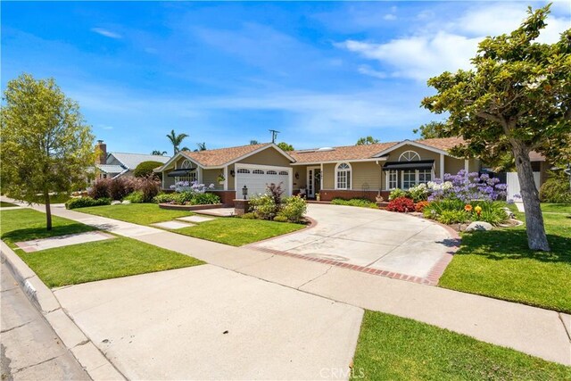 3191 Woodstock Rd, Rossmoor, CA 90720 - ranch-style home with a front yard, driveway, and a garage