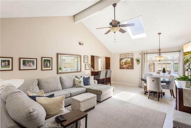 3191 Woodstock Rd, Rossmoor, CA 90720 - living room with high vaulted ceiling, a skylight, ceiling fan, and beam ceiling