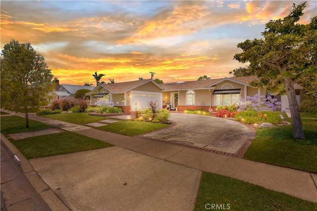 3191 Woodstock Rd, Rossmoor, CA 90720 - ranch-style home with a front yard, concrete driveway, an attached garage, and brick siding