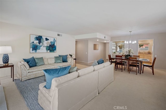 5520 Via La Mesa Unit A, Laguna Woods, CA 92637 - living room featuring a chandelier and light carpet